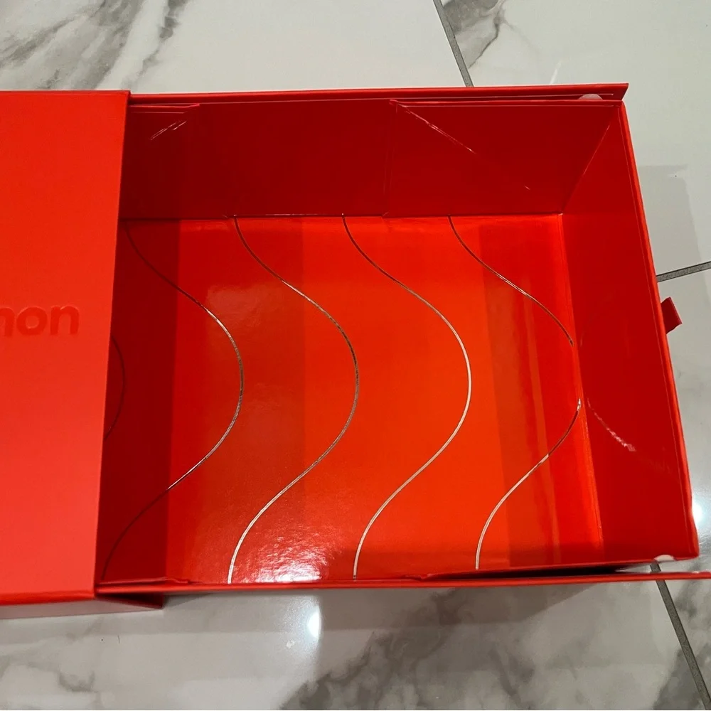 Lululemon — Vibrant Orange Decorative Gift Box.